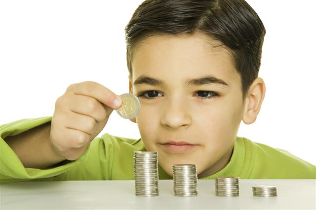 Boy sorting coins