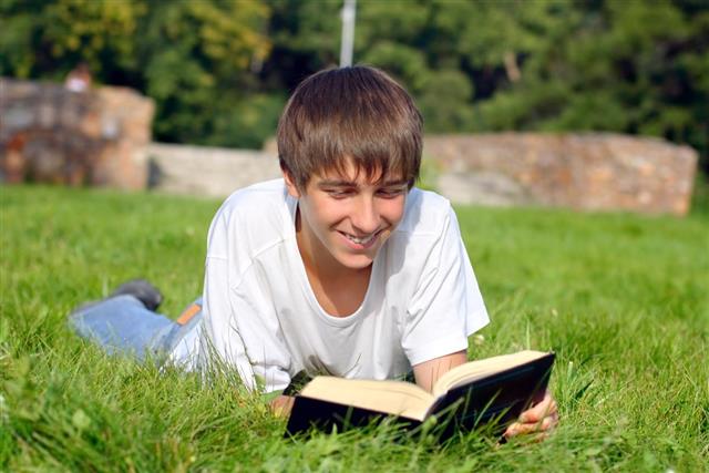 Teen Boy Reading Book