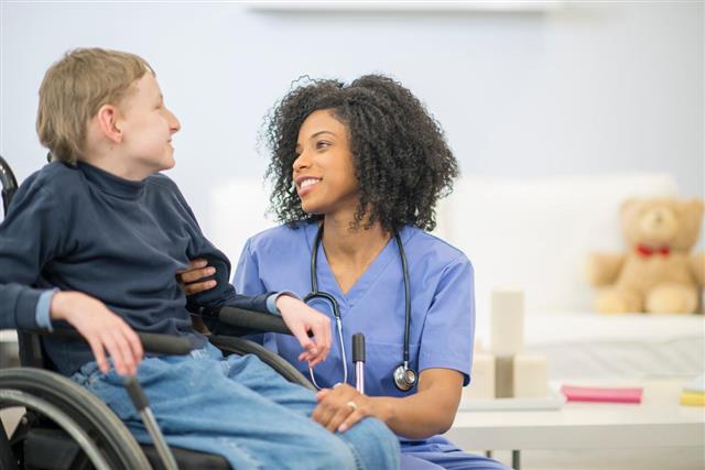 Nurse talking with disabled child
