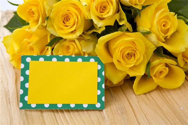 Yellow roses and card