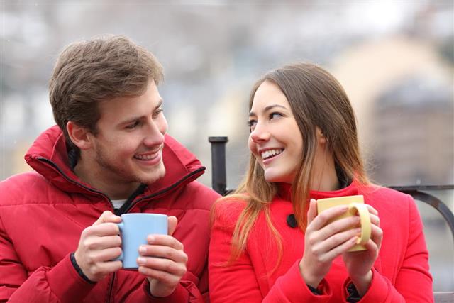 Couple talking relaxed in winter