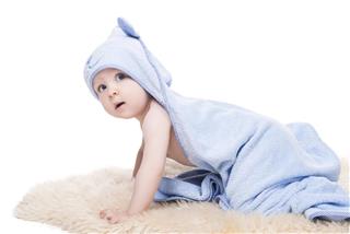 cute baby in blue bathrobe isolated on white