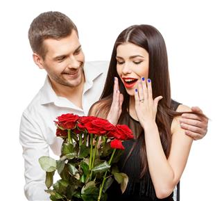 Young beautiful couple with flowers