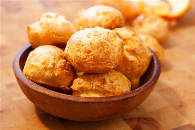Bowl of cheese gougeres on table