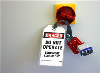 Locked equipment with locks and danger sign notice