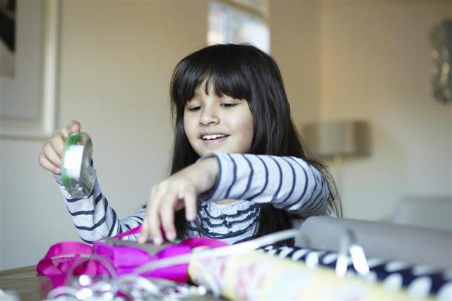 Girl wrapping presents