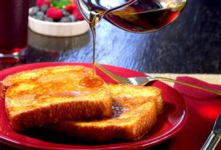 Fresh French Toasts with Pouring Syrup