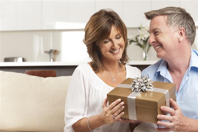 Man giving his wife a gift