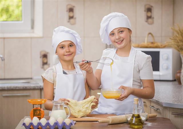 two girls cook