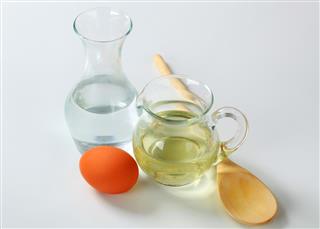 Water, oil, egg and wooden spoon