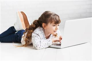 Cute Little Girl Using Laptop