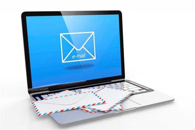 Image of laptop with an email on the screen with mail on top