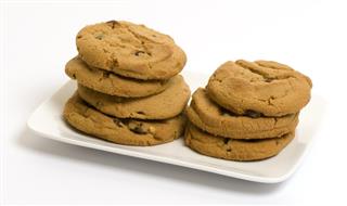 Two stacks of peanut butter and chocolate chip cookies
