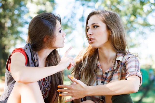 Two girlfriends outdoor talking