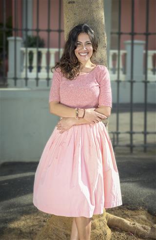 Lady in pink frilled frock