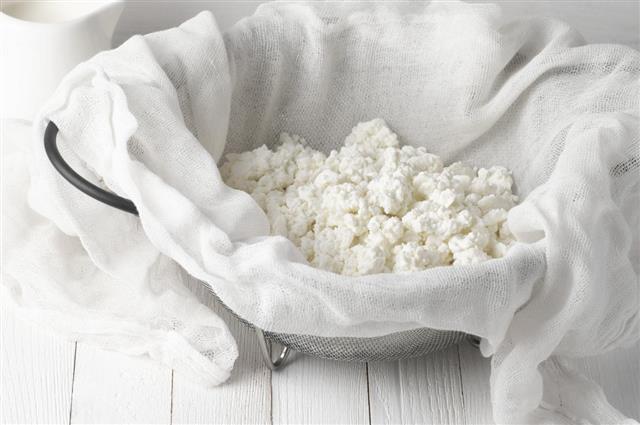 Cottage cheese in cheesecloth