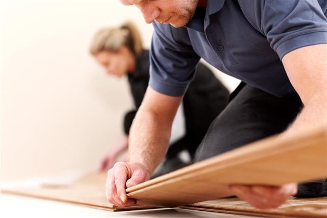 workers installing new wooden floor