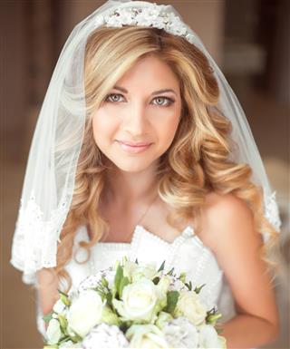 Wedding portrait Beautiful bride girl with long wavy hair