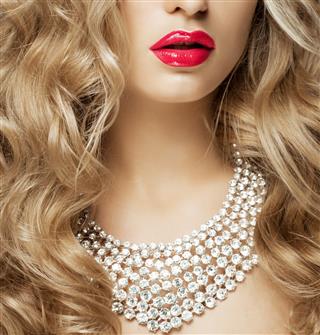 Blonde wearing diamond necklace