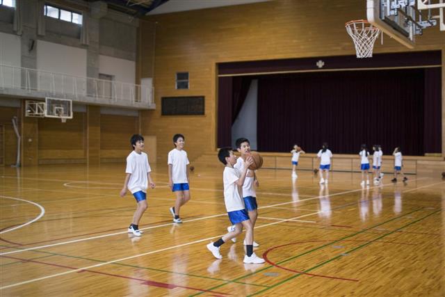 Japanese children practicing basketball