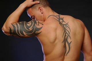 male with tattoo's