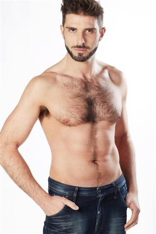Handsome hairy chest man standing hands in pockets