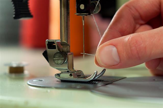 Threading the needle in a sewing machine