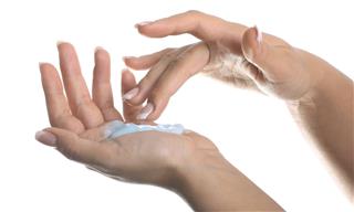 Beautiful female hand applying moisturizer (Isolated)