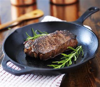 New York strip steak cooked in iron skillet