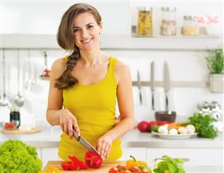Woman Cutting Fresh Vegetable