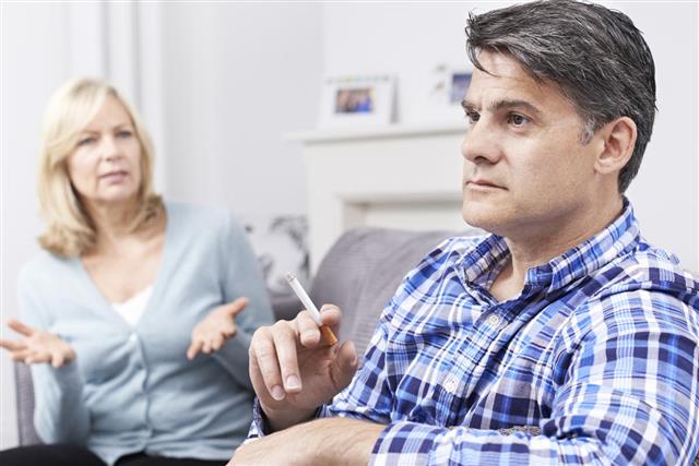 Mature Couple Arguing Over Smoking At Home