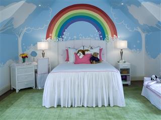 Kids room with rainbow mural