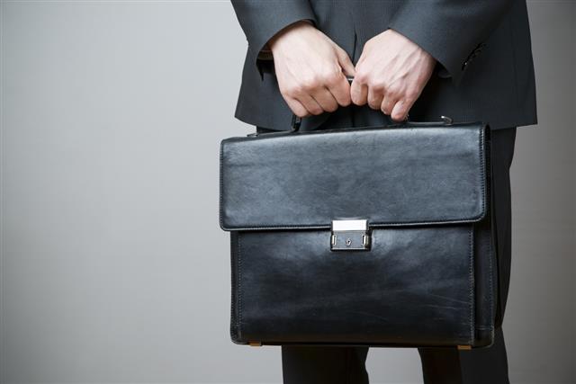 Businessman with briefcase in hand