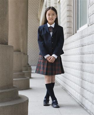 Elementary schoolgirl in school uniform