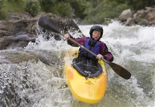 Woman White Water Kayaking