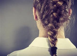 Back view of woman with blonde braid