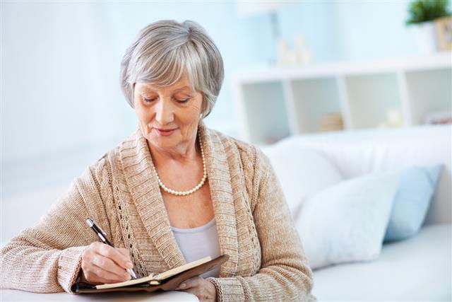 Senior woman writing