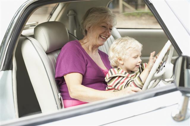 Grandmother and grandson in car