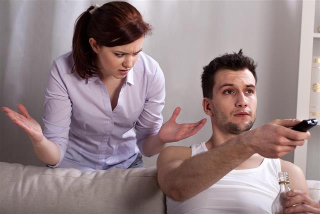 Frustrated Woman Talking with Lazy Man