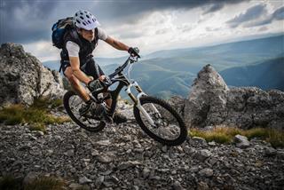 Cyclist riding on a mountain trail