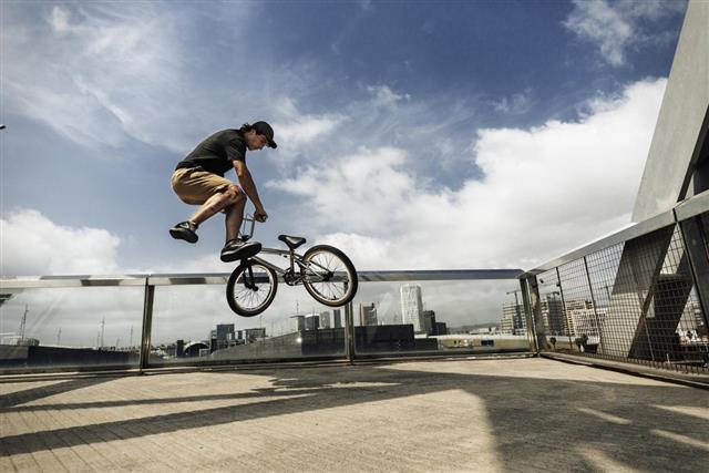 BMX rider jumping in the city
