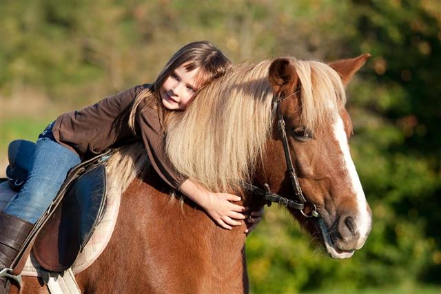 Little girl and her pony