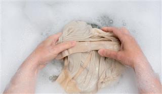 Woman handwashing clothing