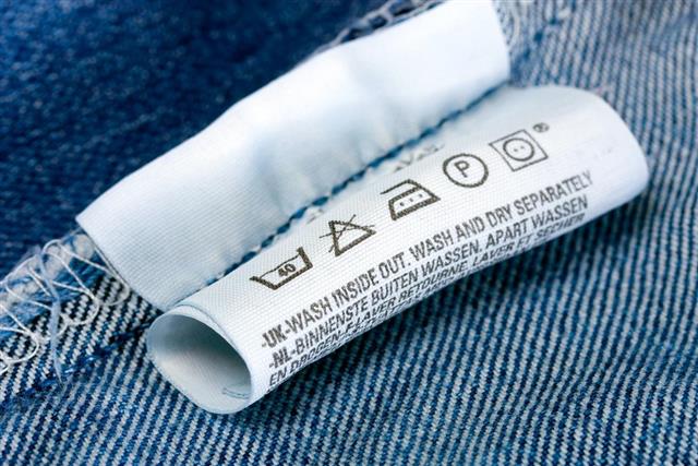 Care instructions label on the inside of a denim garment