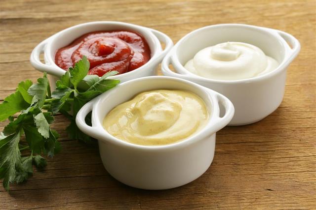 Mustard, ketchup and mayonnaise - three kinds of sauces