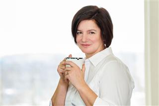 Woman With Cup Of Coffee