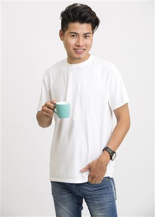 Smart young man with coffee cup