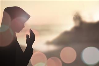 Muslim Woman pray and Beautiful background