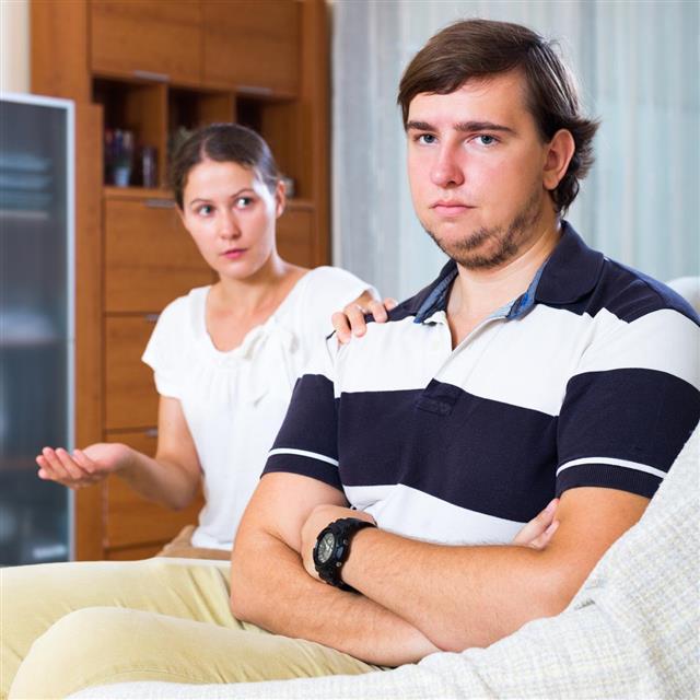 Unhappy husband stop quarreling with wife