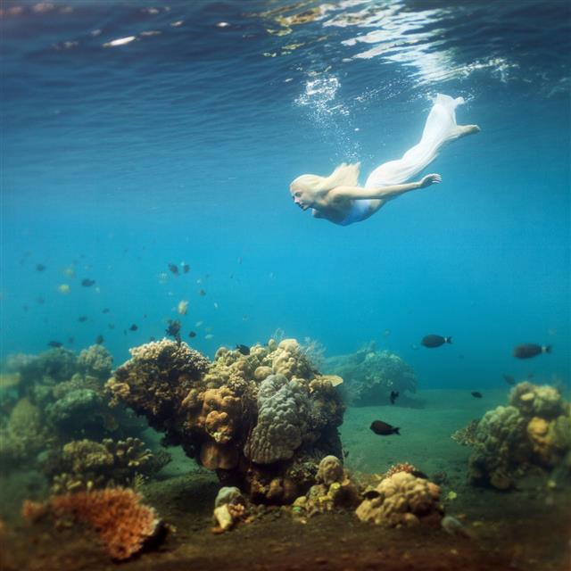 Young Woman Dive Into Deep Water